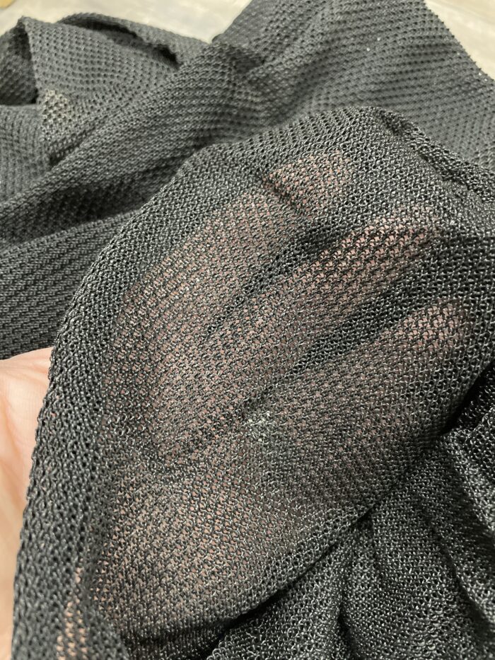 hand in empty mesh to show density