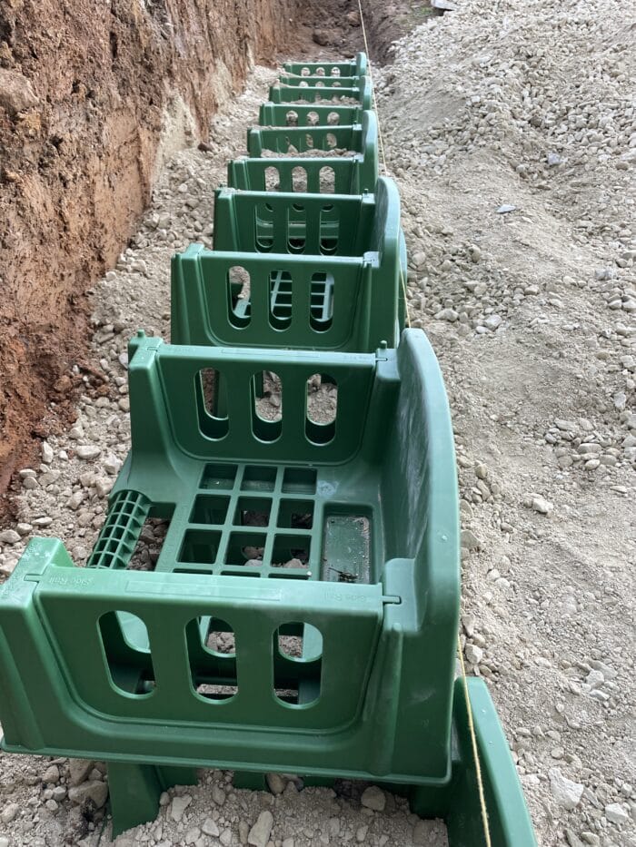 Base course of varden blocks installed
