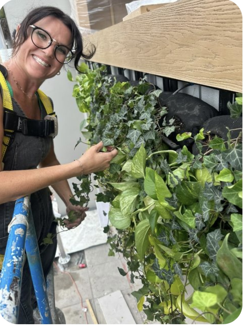 Lindsay Lamb of Lamb and Company installing a varden living wall on Rock the Block Season 5