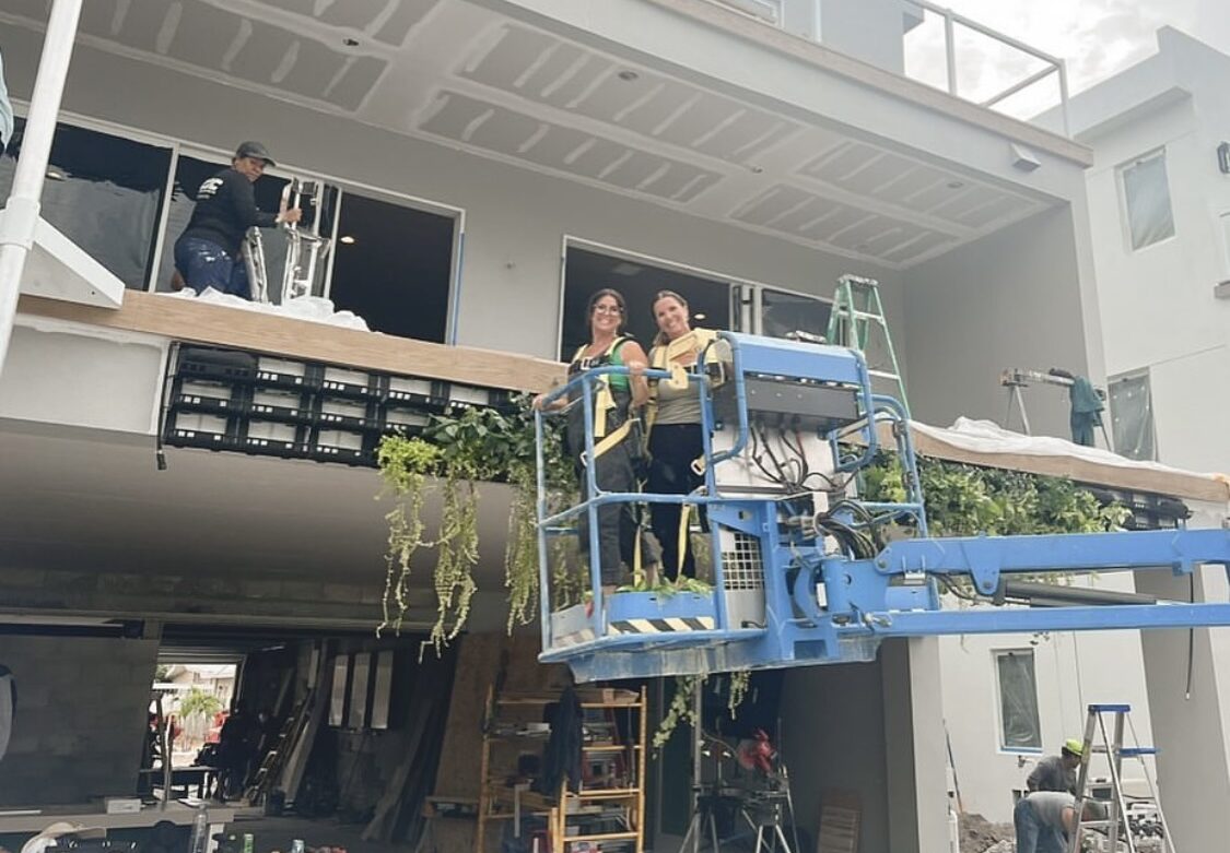 the Twins installing a living wall on rock the Block Season