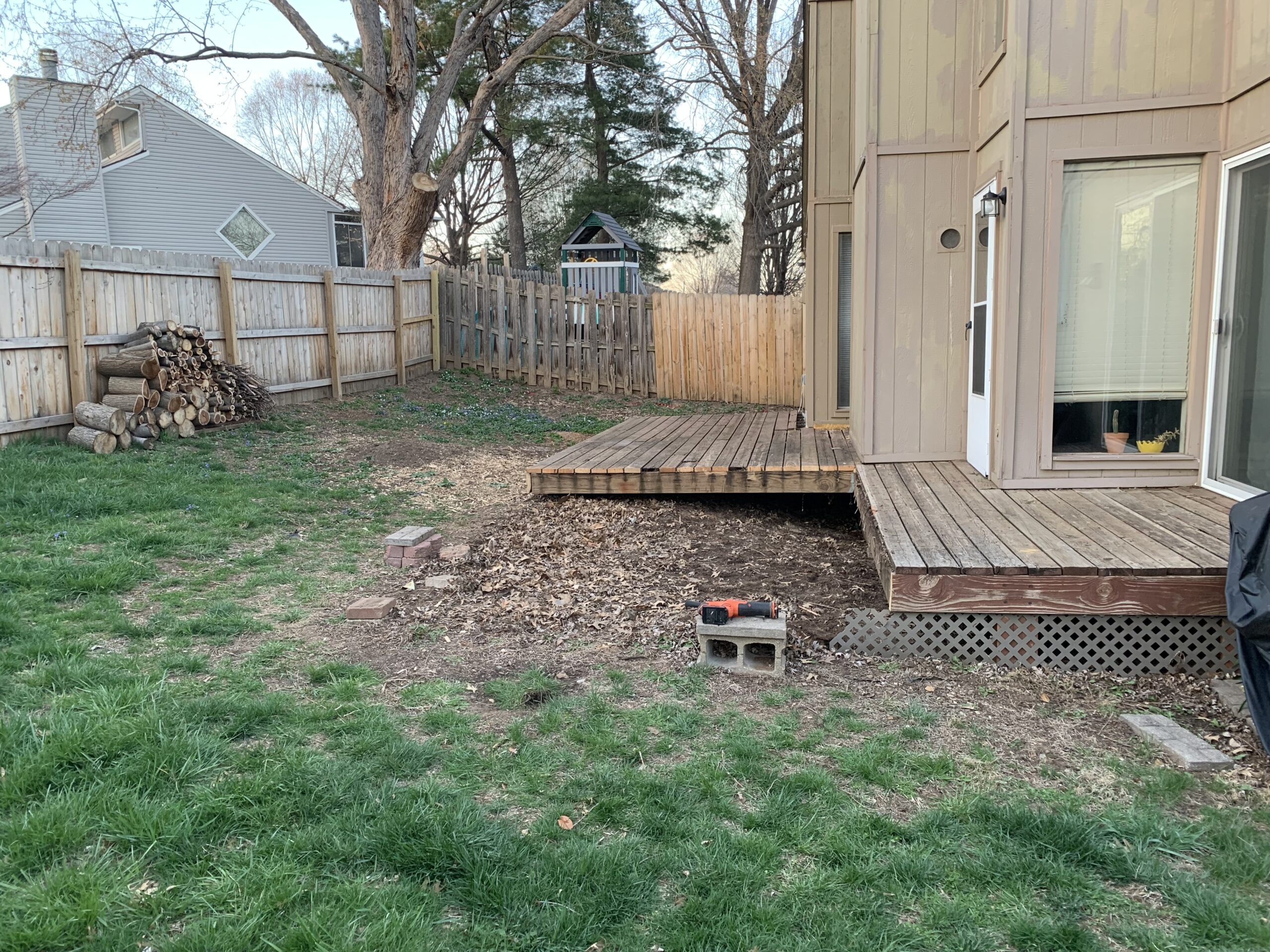 Before construction of the Varden Living Retaining Wall for patio expansion