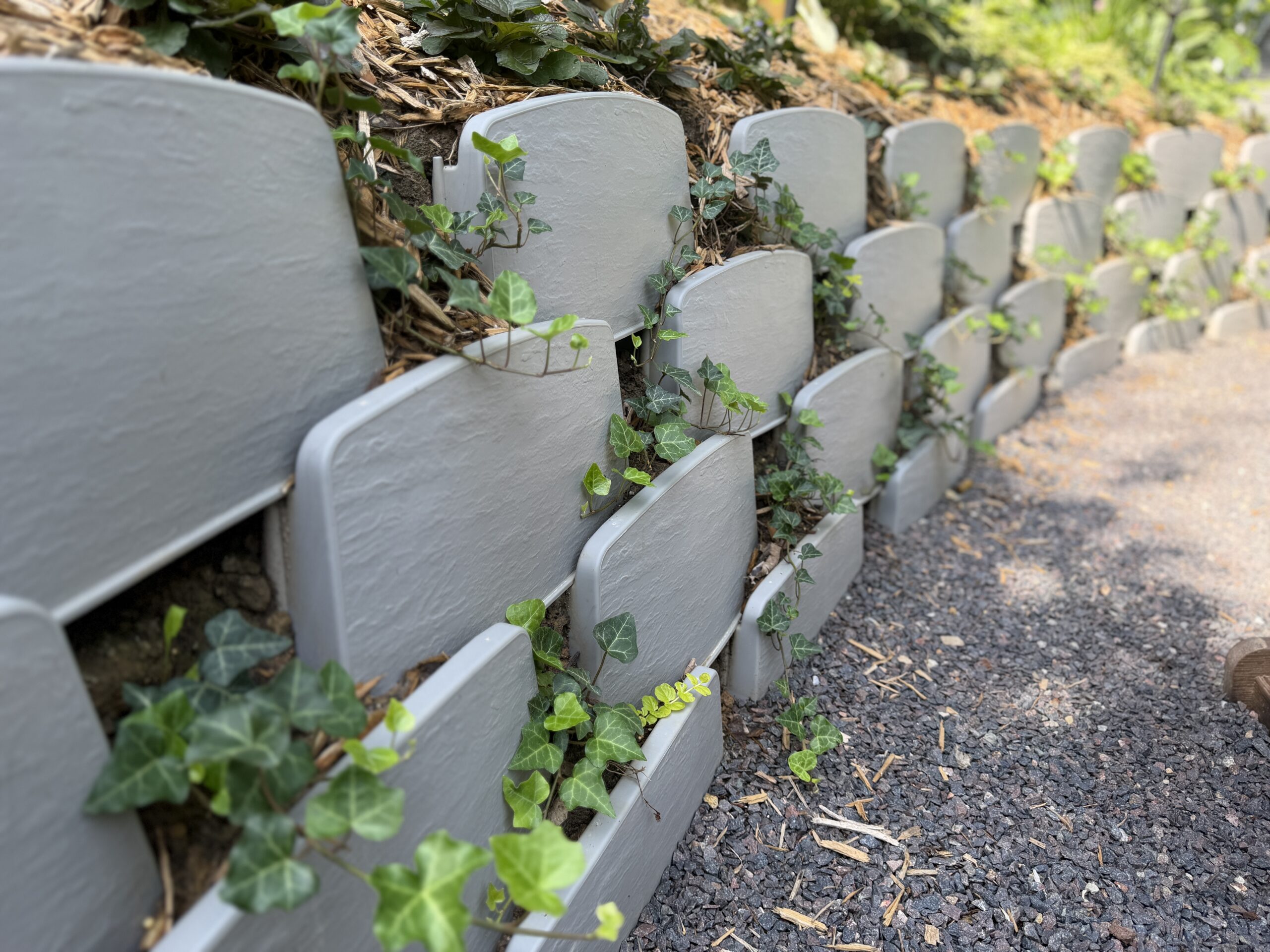 Close up view of Varden block retaining wall with ivy