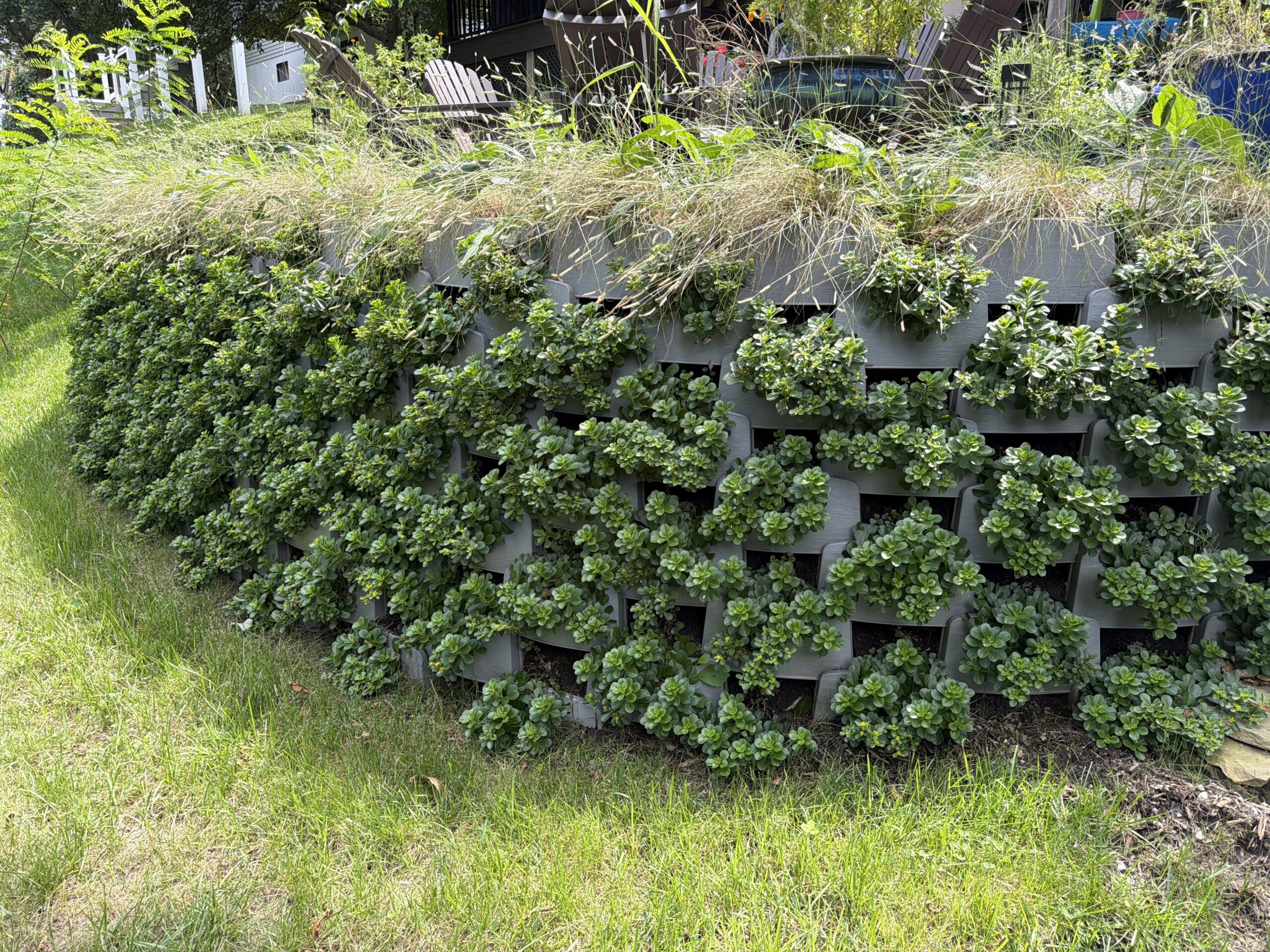 Varden plantable block retaining wall with mature plants covering the wall face